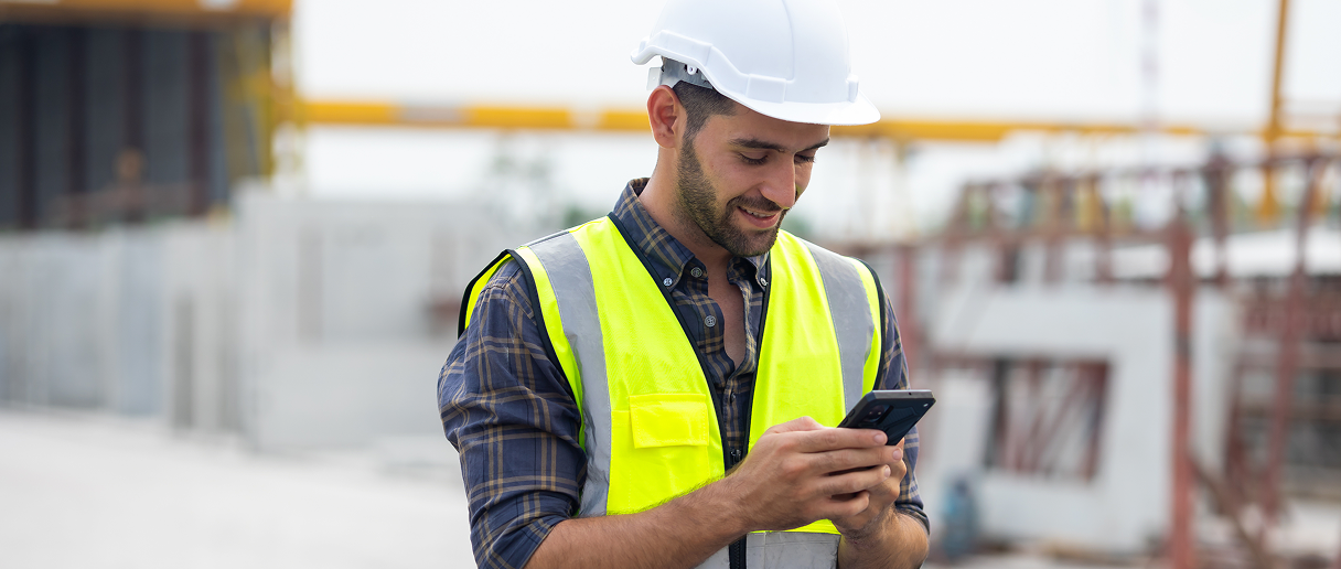 WorkAware safety worker on construction site using mobile device