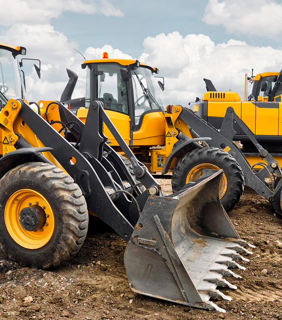 Heavy equipment on site requiring inspection and maintenance tracking